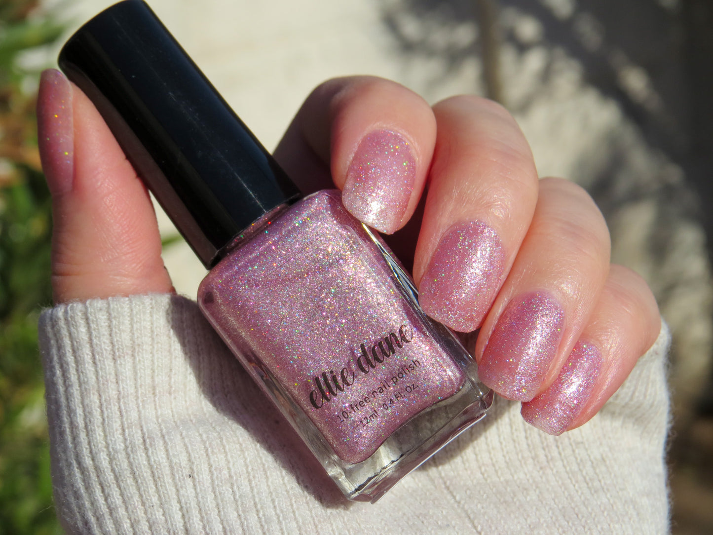 Holographic Pink Rose Quartz in direct sunlight on nails