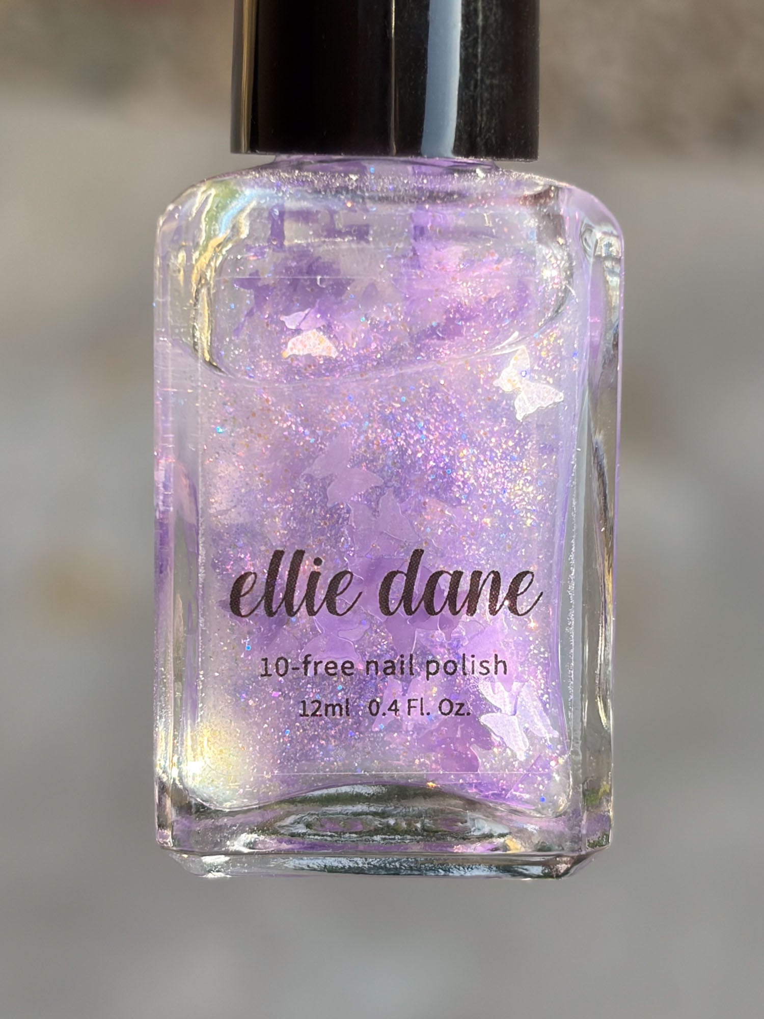 Ellie Dane nail polish bottle with glittery purple butterfly polish